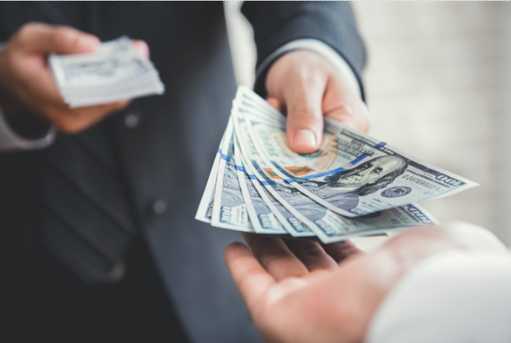 Business payment being transferred between two professionals